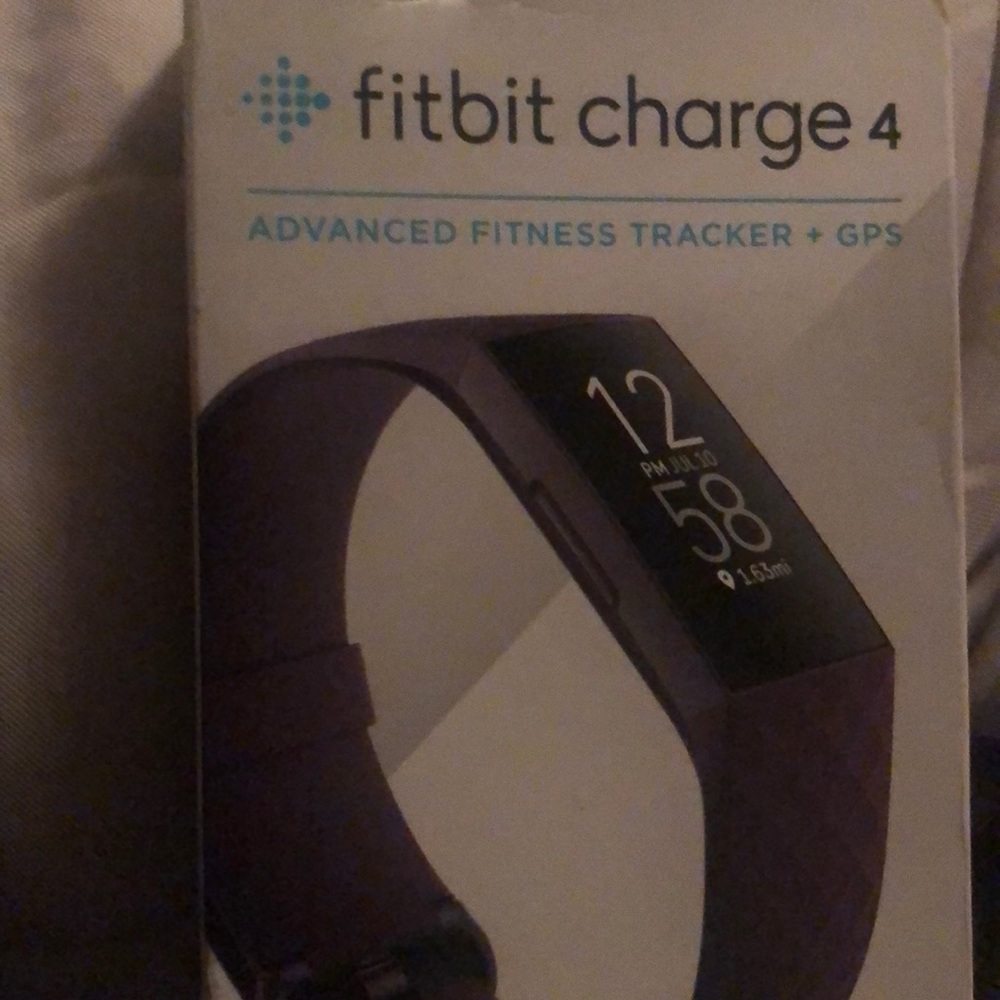 Brand new Fitbit charge in original box never opened.